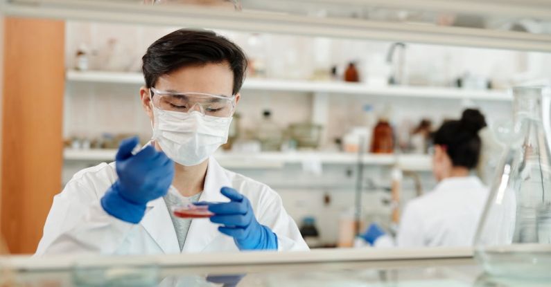 Bioengineering - Man Doing A Sample Test In The Laboratory