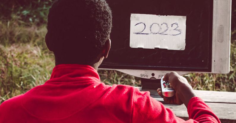 Gap Year - A man sitting in front of a computer with the word 2020 on it