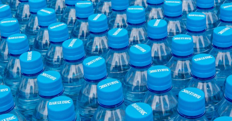 Plastic Recycling - A large group of blue water bottles