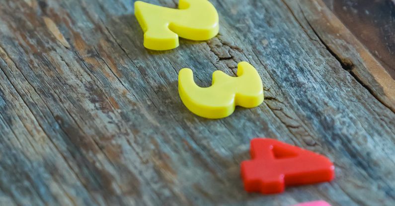 Math Puzzles - Multicolored numbers for counting on wooden table