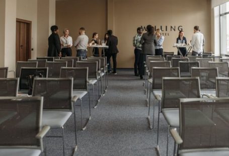 Cognitive Function - Group of People Standing and Talking in a Room