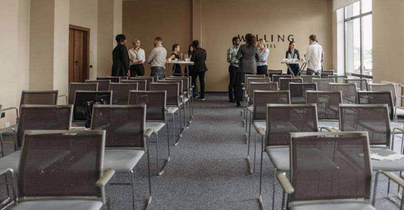 Cognitive Function - Group of People Standing and Talking in a Room