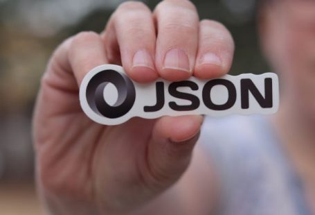 Object-Oriented Programming - Person Holding Logo of JSON